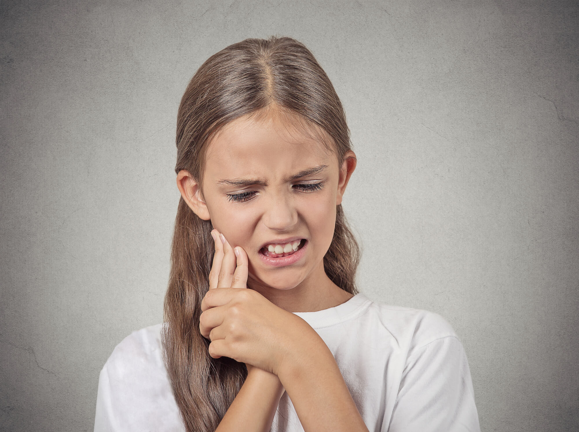 little girl with a terrible toothache